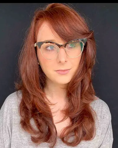 Mid-Back Layered Hair with Side-Swept Bangs and a Deep Side Part