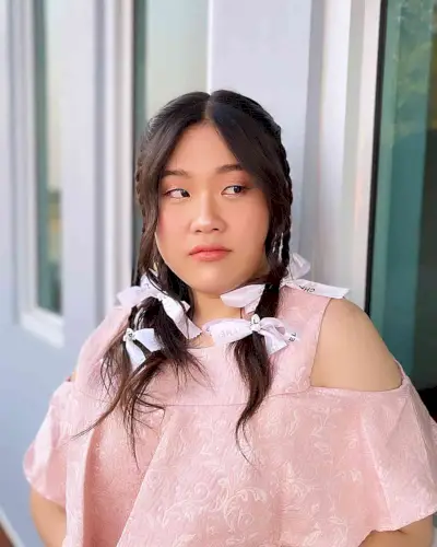 Y2K Braided Pigtails with Face-Framing Layers and White Bows for Mid-Length Hair