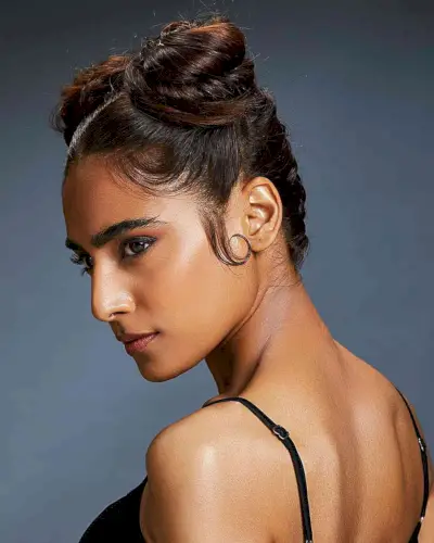 Center-Parted Double Bun Hairstyle for Cheerleaders