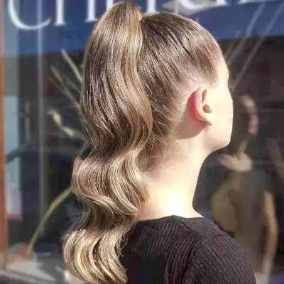 Wavy Sleek Ponytail Updo for Cheerleaders with Long hair