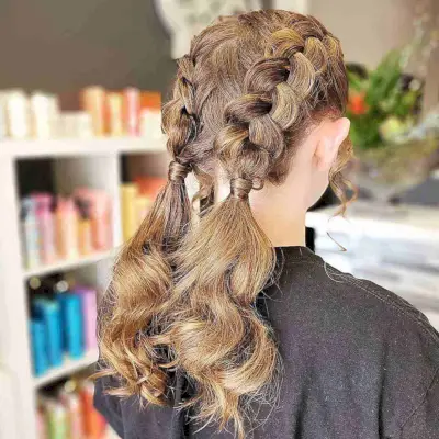 Mid-Length Low Pigtails with Dutch Braids for Young Cheerleading Dancers