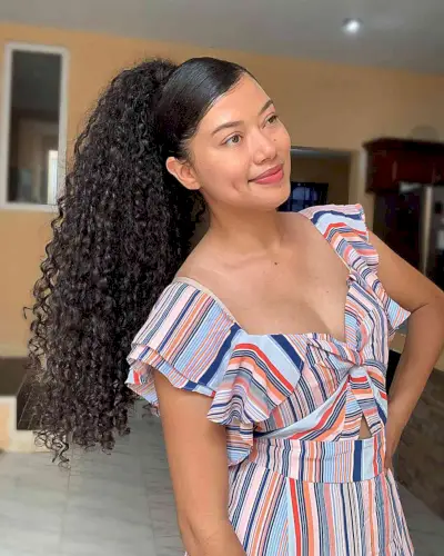 Hawaiian-Style Deep Side Part Ponytail for Long Curls Perfect for Summer