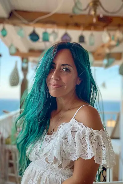Waist-length hair with mermaid teal color and beachy waves