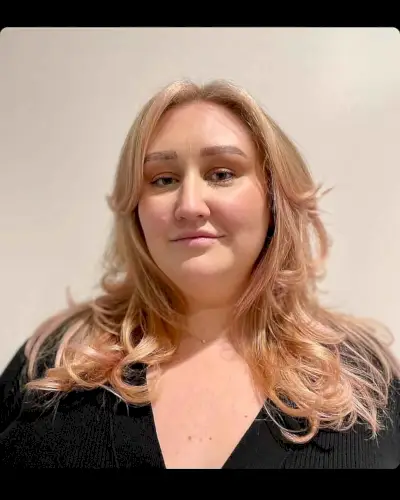 Youthful Layered Haircut with Long Curtain Bangs