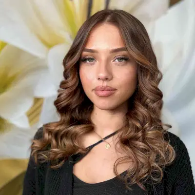 Medium-Length Curled Ends with Balayage Highlights