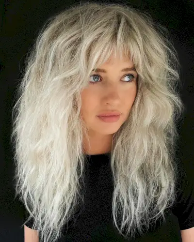 Razor cut for long blonde hair with bangs