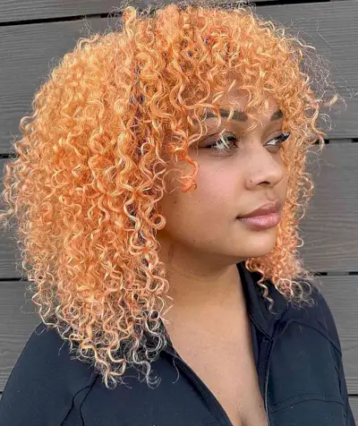 Shoulder-Length Light Peach Curly Hair with Bangs for Festivals