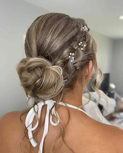 Medieval Romantic Bronde Low Bun with Side Braid