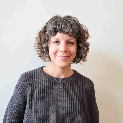 Curly bob haircut with short bangs gender neutral hair