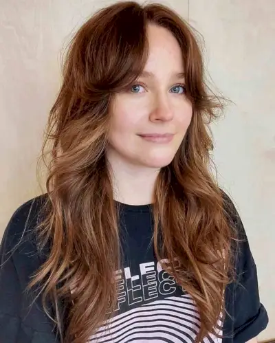 Effortless Brunette Shag with Feathered Bangs for Summer