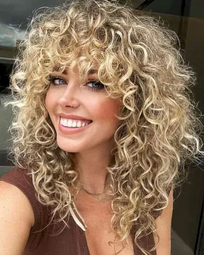 80s Textured Curly Shag with Bangs on Medium Haircut
