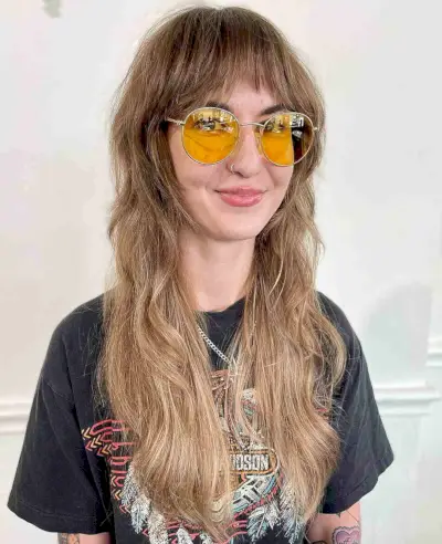 Hippy Long Shaggy Cut with Choppy Bangs 1960s Hairstyle