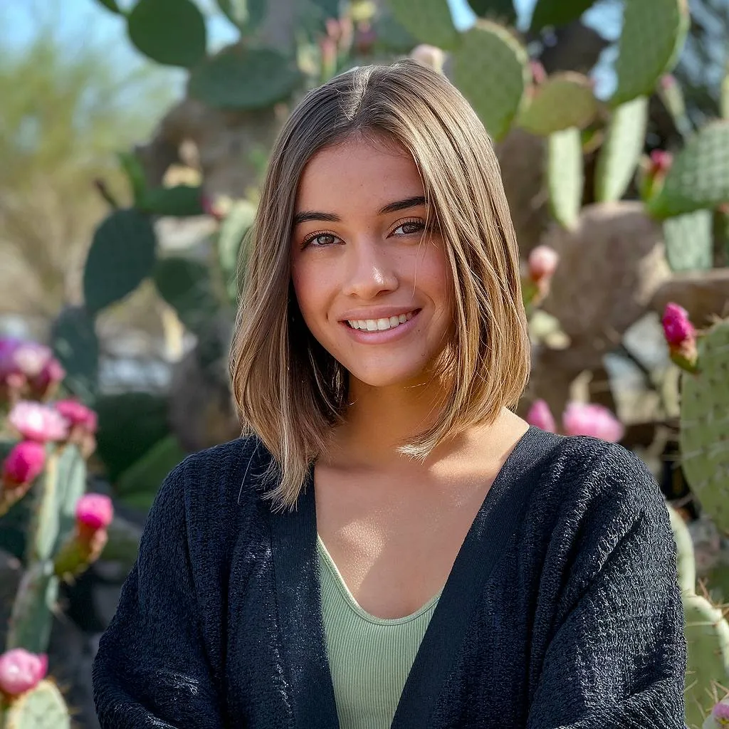 Lige skulderlang bob med bløde ender en slank og poleret forårsklip for moderne elegance' title=