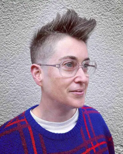 High-volume Mohawk with spiky top and clean undercut on fine to medium hair