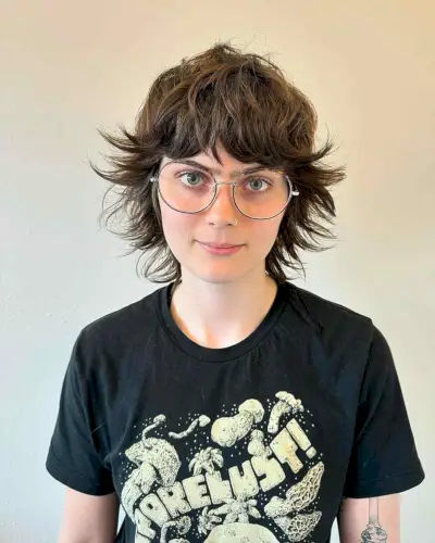 Feathered wolf cut with choppy layers and shaggy texture on medium to thick hair