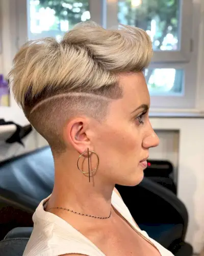 Platinum pompadour with voluminous top and undercut design on fine to medium hair