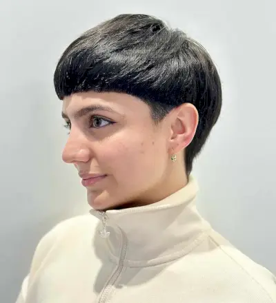 Edgy bowl cut with blunt fringe and undercut on straight, medium-density hair