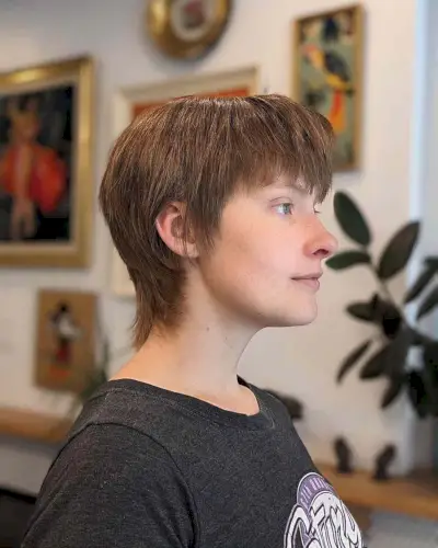 Soft layered mullet with natural texture and subtle layers on fine to medium hair