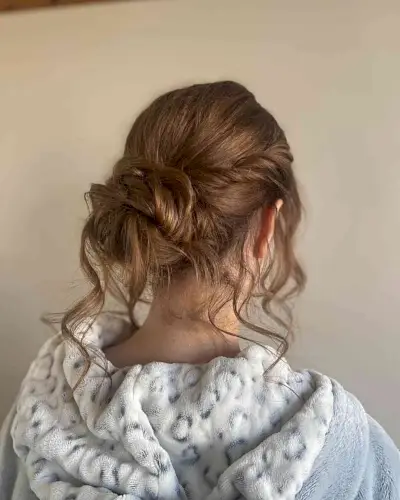 Messy Twisted Updo with Loose Strands for Girls