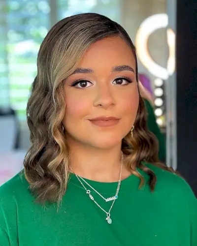 Shoulder-Length Side-Swept Hairstyle with Glam Waves for Graduating Girls