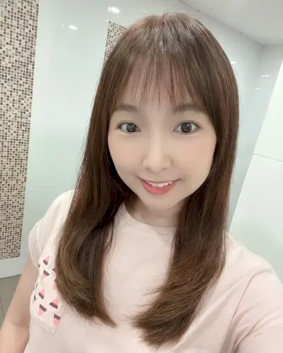 Medium Haircut with a Wispy Fringe