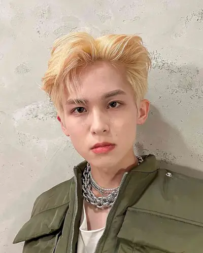 Kpop Flowy Hairstyle with Blown Back Bangs for Young Guys with Blonde Hair
