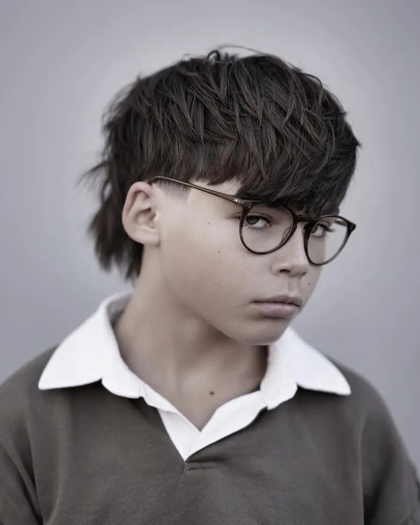 Top lungo e spesso disordinato per ragazzi' title=