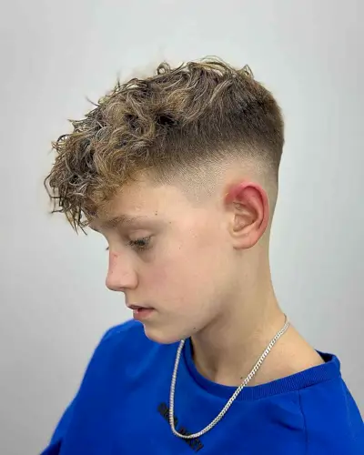 Mid Fade with a Messy, Curly Top for Boys