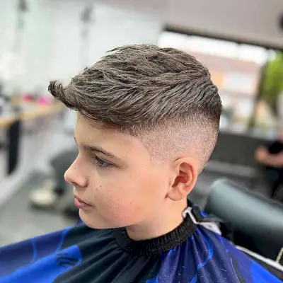 Fade with a 0.5 Guard and a Long Top for Young Boys with Brown hair