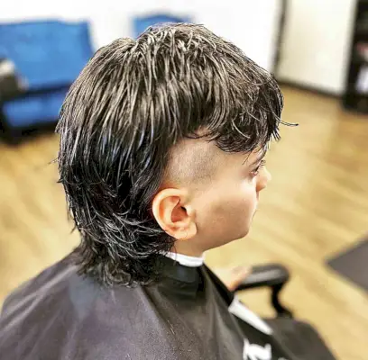 Long Layered Mullet with Bangs and Shaved Sides for Young Boys