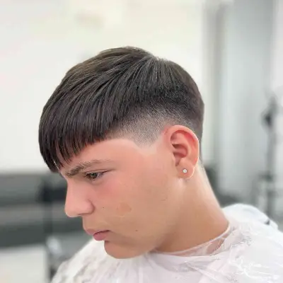 Razored Mid Fade with Bangs for Teen Boys