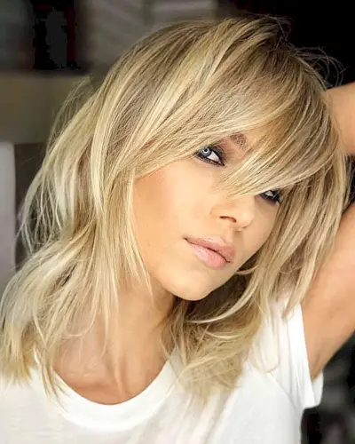 Blonde Layering with Long Fringe