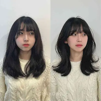 Bottleneck Bangs on Soft Wavy Layered Hair