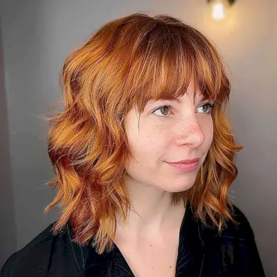 coppery layered medium-short bob with micro bangs