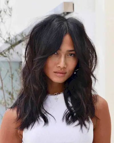 Sassy Mid-Length Shag with Long Curtain Bangs and Layers