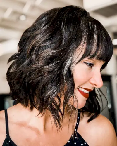 tousled neck-length bob with straight bangs