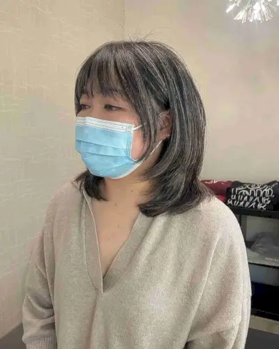 Medium Layers with Subtle Highlights on Shorter Hair