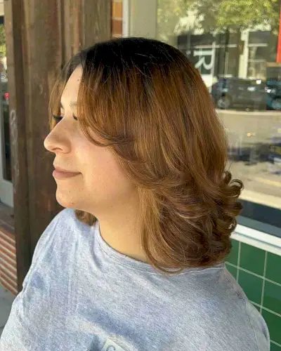 Medium Layered Blowout Style on Rooted Brown Hair