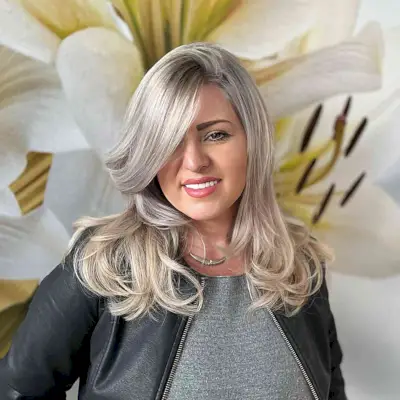 Deeply Side-Parted Layered Cut for Straight Hair on women with round faces