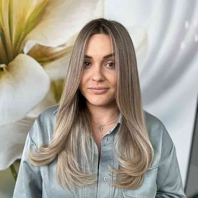 Brown Balayage on Straight Layered Hair for women with face-framing and curled ends