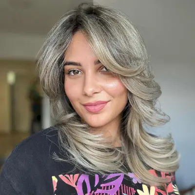 Straight Layered Ashy Blonde Hair with Curled Ends