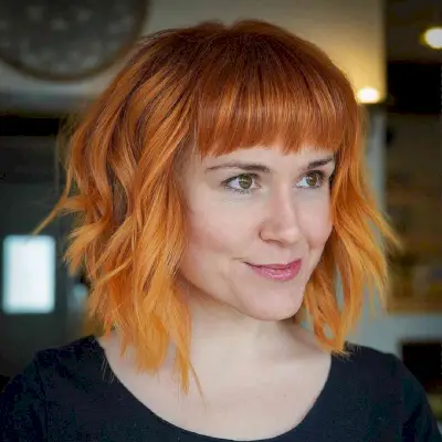 Medium-Length Layered Bob with Straight Bangs