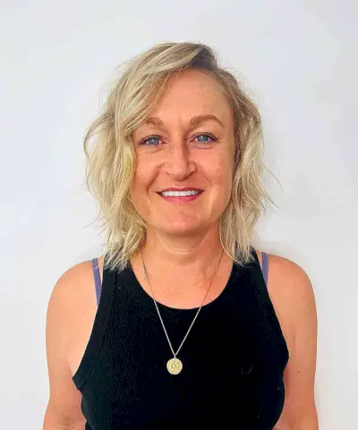 Shoulder-Length Wavy Tousled Layered Style with Deep Side Part for Thinner Locks