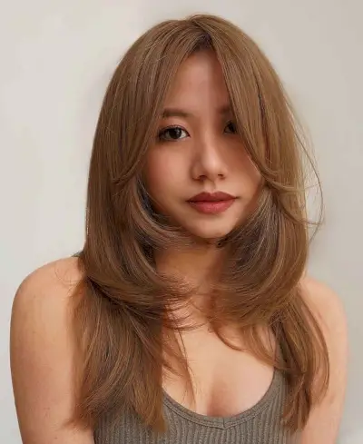 layered and long hair with curtain bangs