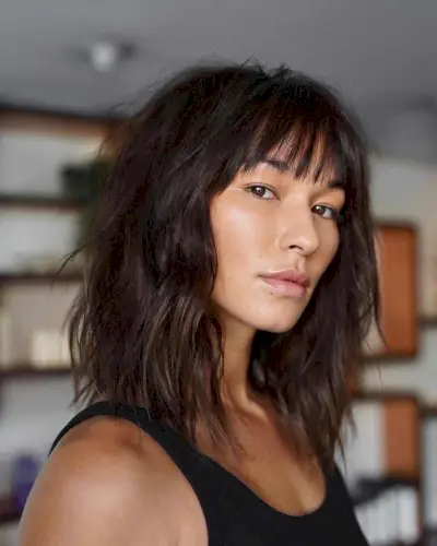 Medium choppy layers with bangs hairstyle