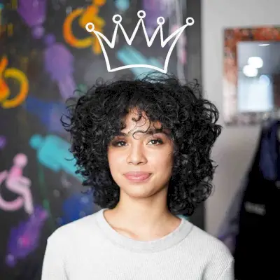 Short Layered Curls with Face-Framing Bangs for a Girl