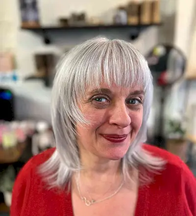 Layered Shaggy Wolf Cut with Wispy Bangs for older women with very thin hair