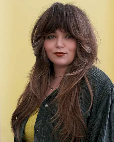 Long Layered Shag with Thick Bangs for Round Faces