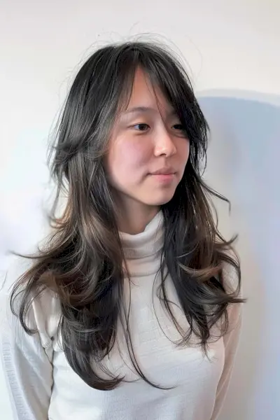 Medium long wolf haircut with soft graduated layers