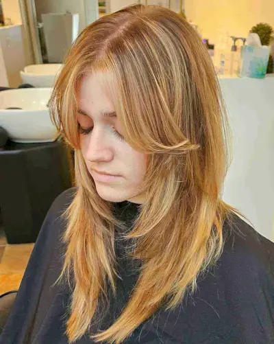 Long-Length Blonde Wolf Cut with Curtain Bangs for Straight Hair